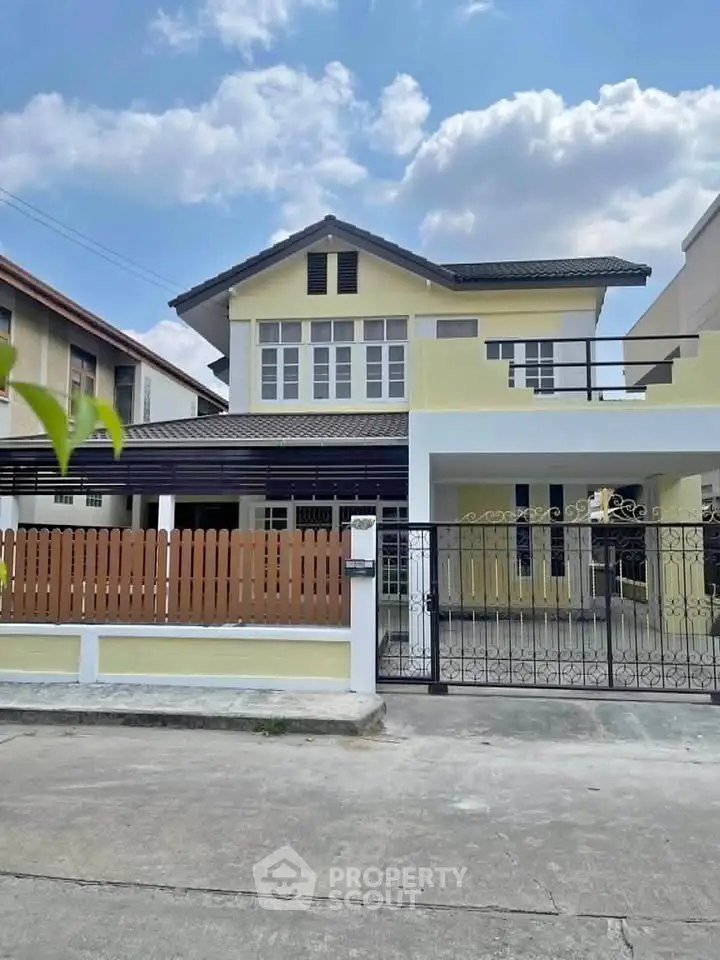 Charming two-story house with modern design and spacious front yard in a serene neighborhood.