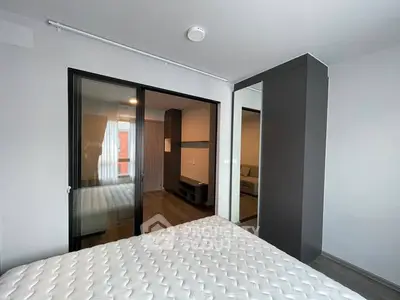 Modern bedroom with sliding glass doors and sleek design