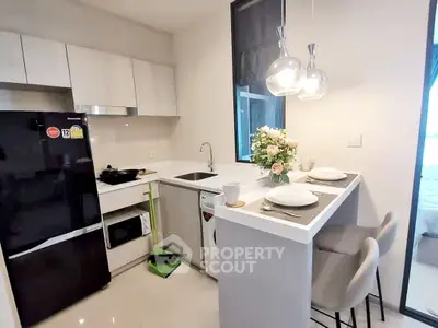 Modern kitchen with sleek appliances and cozy breakfast bar