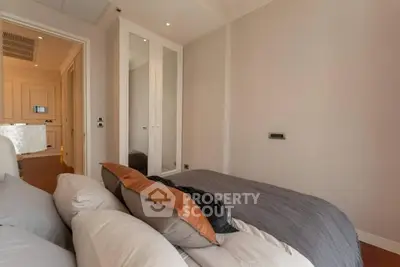Cozy bedroom with modern decor and ample natural light