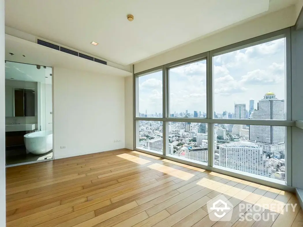 Spacious corner unit with panoramic city views and elegant hardwood floors