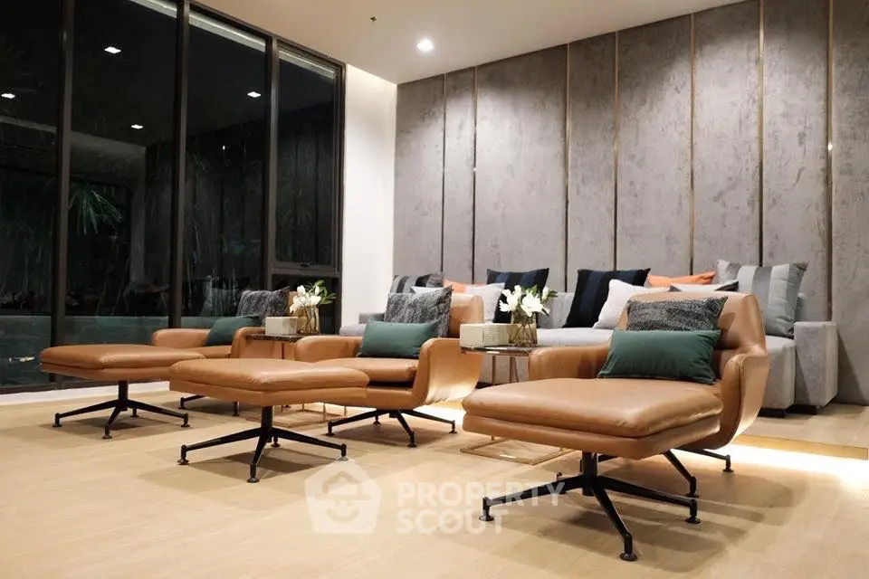 Luxurious modern living room with stylish leather chairs and elegant decor, perfect for relaxation and entertainment.
