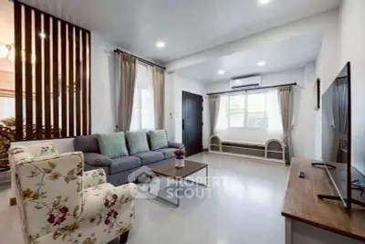 Spacious modern living room with elegant decor and natural light.