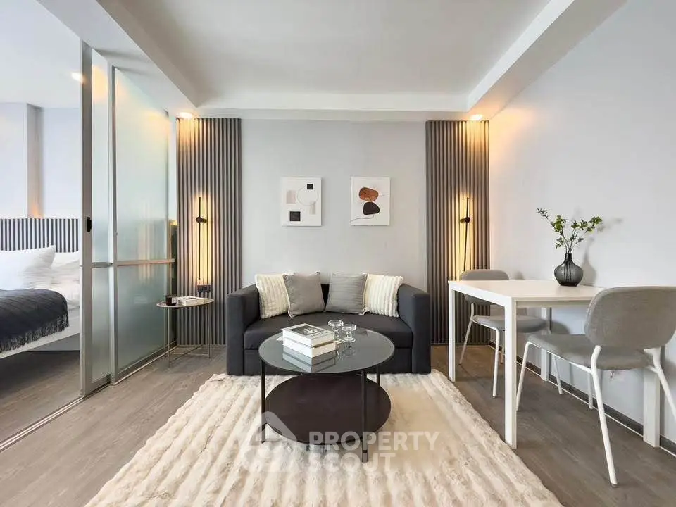 Modern living room with stylish decor and cozy ambiance in a contemporary apartment.