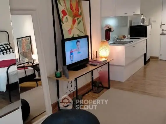 Cozy studio apartment with modern kitchen and stylish decor