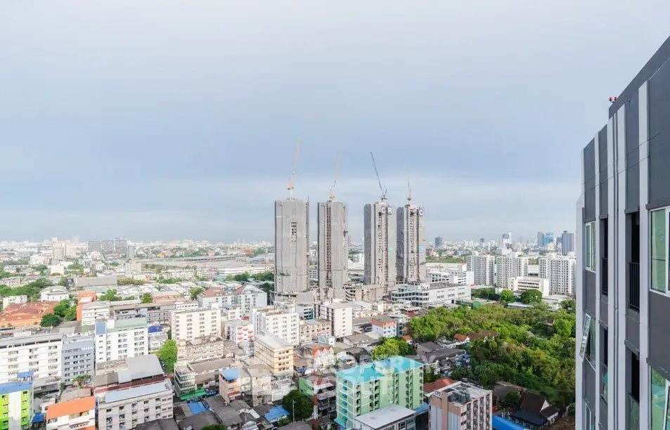 Stunning cityscape view from high-rise building showcasing urban development and skyline.