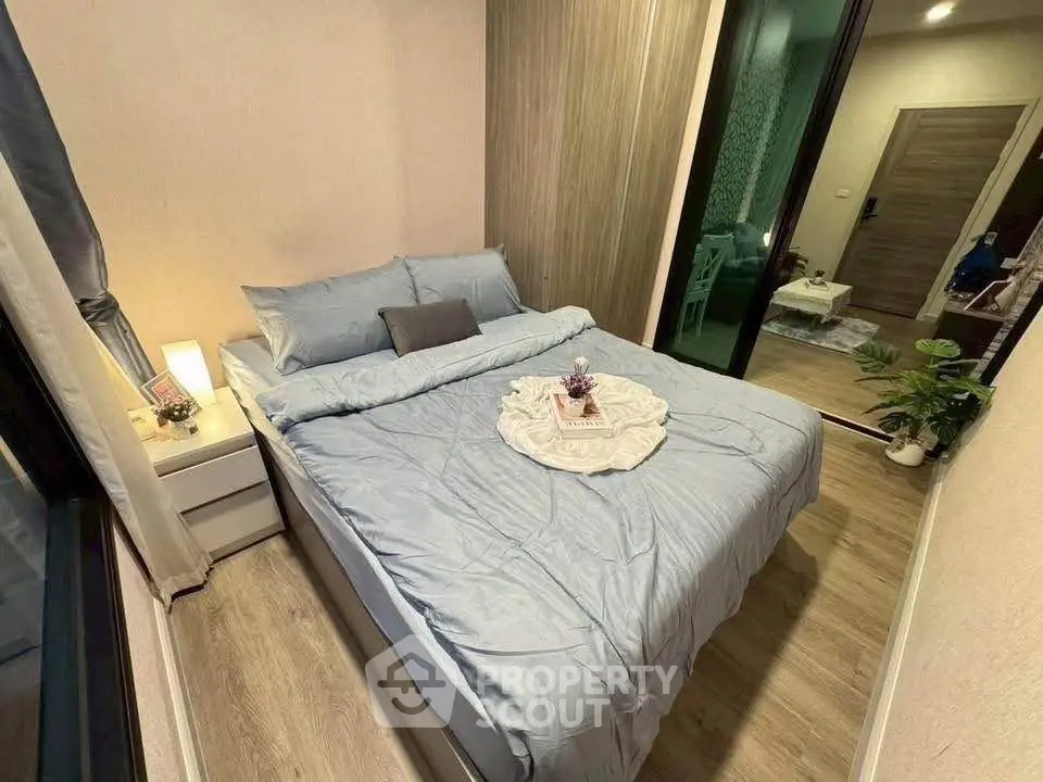 Cozy bedroom with modern decor and soft lighting, perfect for relaxation.