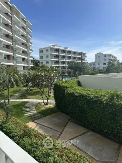 Luxurious residential complex with lush gardens and modern architecture
