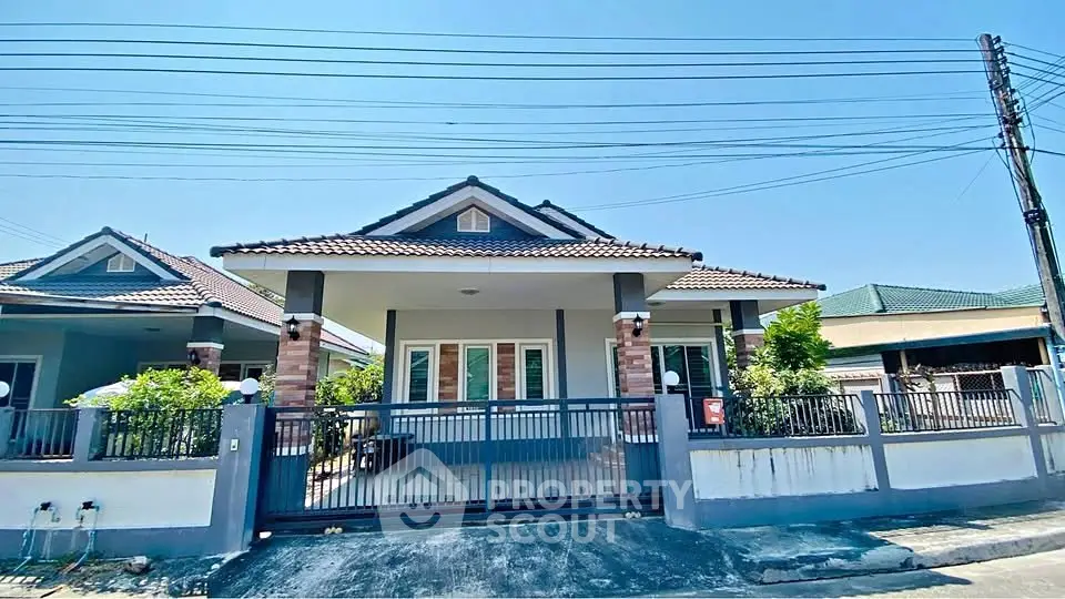 Charming single-story house with modern design and spacious front yard in a serene neighborhood.