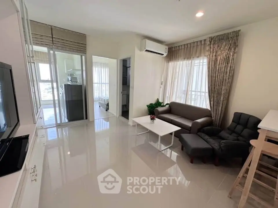 Spacious modern living room with sleek furniture and natural light
