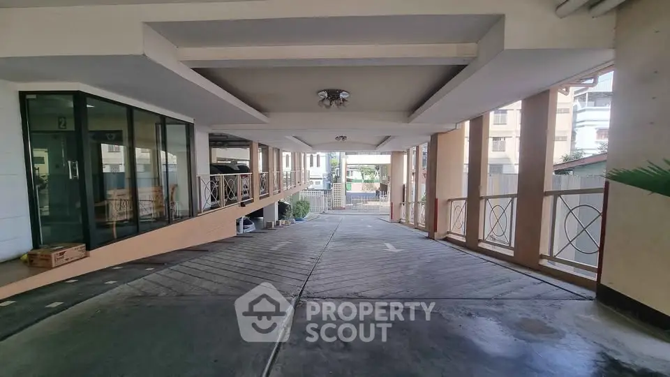 Spacious covered parking area with modern design and natural light