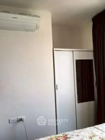 Cozy bedroom with air conditioning and built-in wardrobe