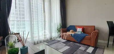 Modern living room with large windows and stylish decor