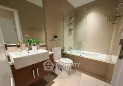 Modern bathroom with sleek fixtures and a bathtub in a contemporary apartment.
