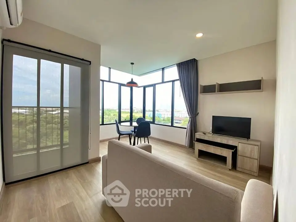 Spacious living room with large windows and scenic view