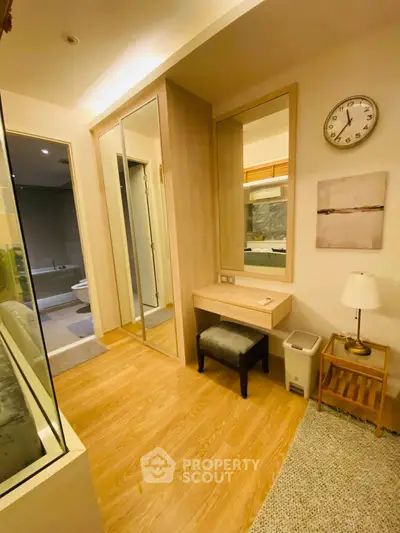 Chic bedroom with elegant vanity and mirrored closet doors