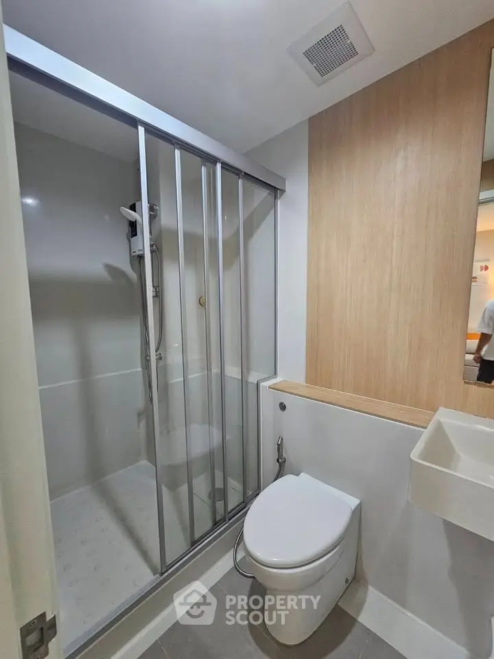 Modern bathroom with sleek shower enclosure and minimalist design