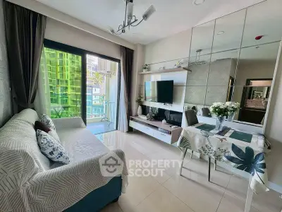 Modern living room with balcony view, stylish decor, and ample natural light in a contemporary apartment.