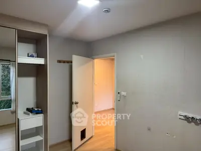 Spacious bedroom with built-in closet and natural light