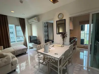 Modern living room with dining area and open kitchen in a stylish apartment