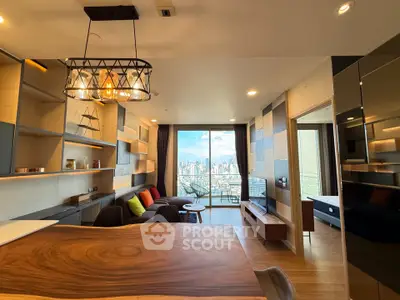 Modern living room with city view, stylish lighting, and open layout in luxury apartment.