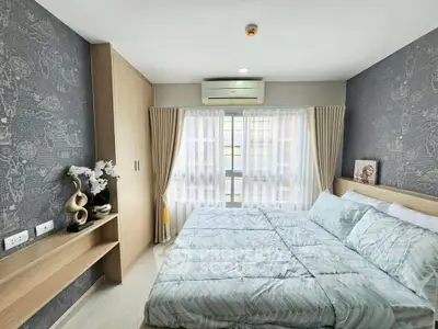 Cozy modern bedroom with stylish decor and ample natural light