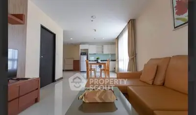 Spacious living room with modern kitchen in open layout apartment