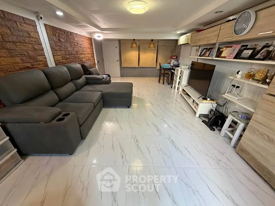 Spacious living room with modern decor and comfortable seating