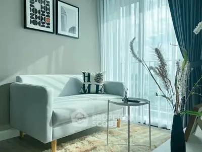 Chic living room with modern decor, cozy sofa, and natural light through sheer curtains.