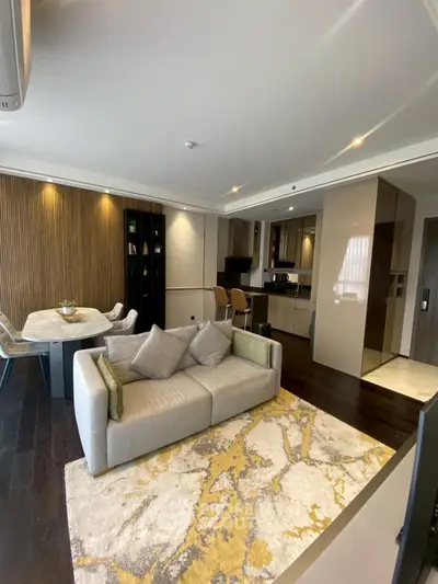 Modern open-plan living room with stylish kitchen and cozy seating area