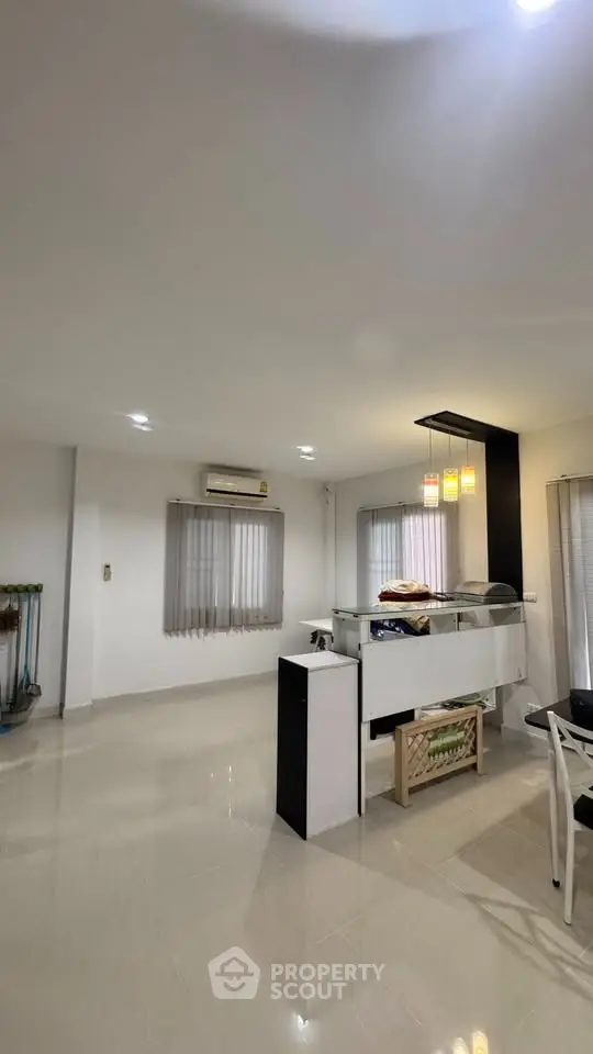 Spacious modern living room with sleek design and ample natural light