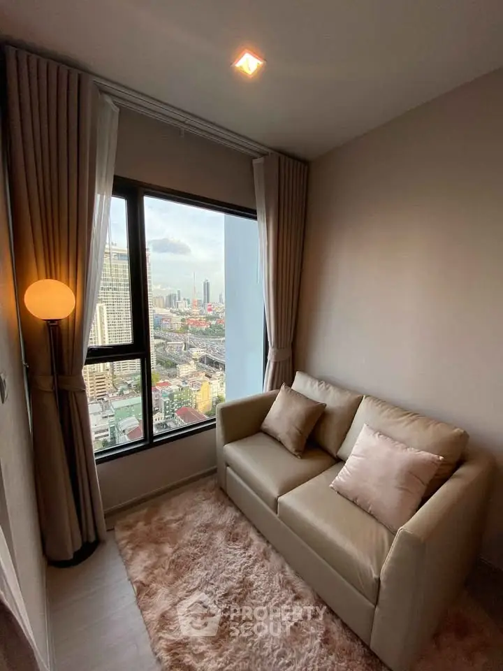 Cozy living room with stunning city view from high-rise apartment