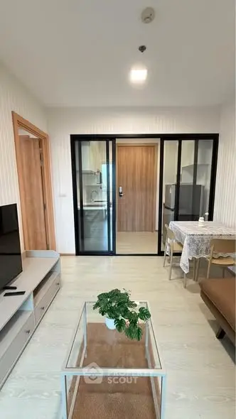 Modern living room with sliding glass doors and stylish decor