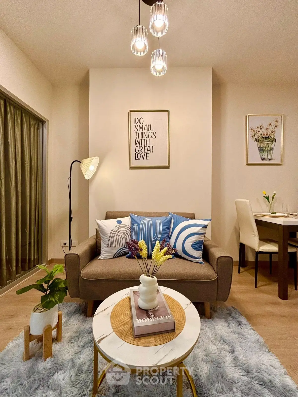 Chic living room with cozy decor and stylish lighting in modern apartment.