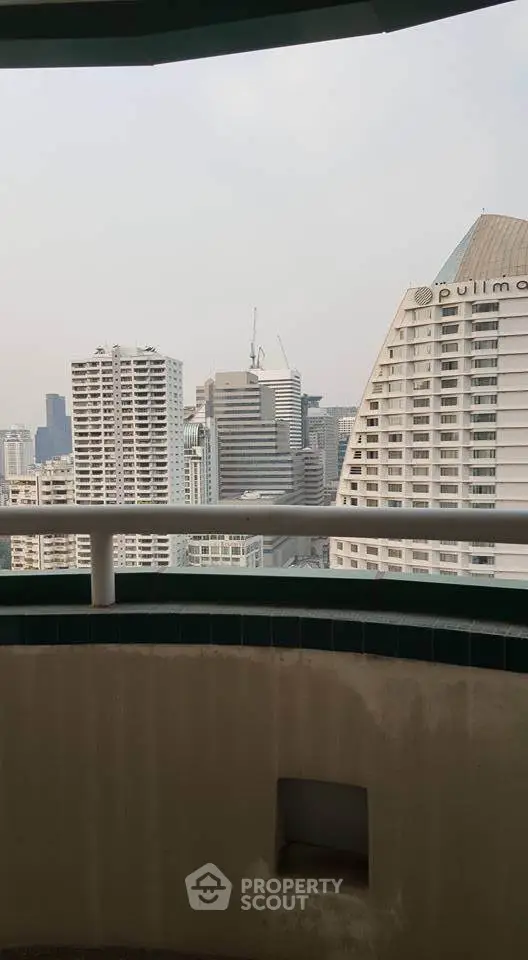 Stunning cityscape view from a high-rise balcony in a modern urban setting.