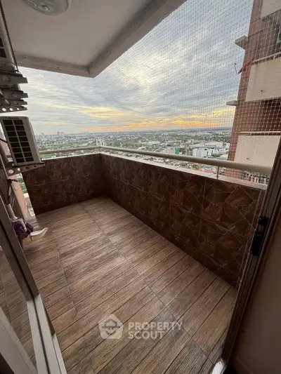 Spacious balcony with stunning city view, perfect for relaxation and enjoying sunsets.