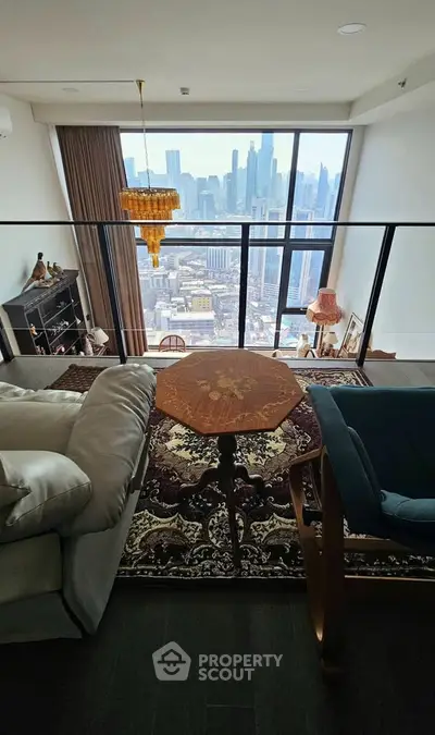 Luxurious living room with stunning city skyline view, elegant decor, and floor-to-ceiling windows.