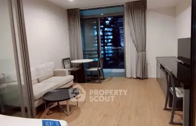 Modern living room with balcony view in urban apartment