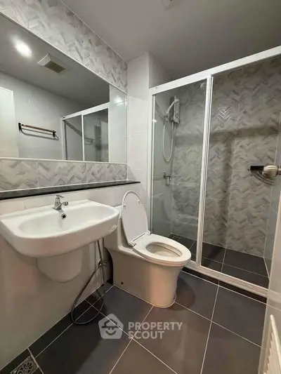 Modern bathroom with sleek shower and stylish tile design