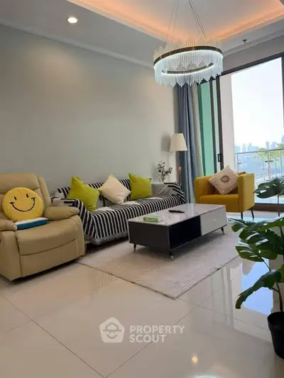 Modern living room with stylish decor and city view balcony access.