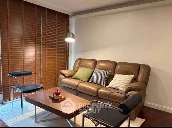 Cozy living room with leather sofa and modern decor