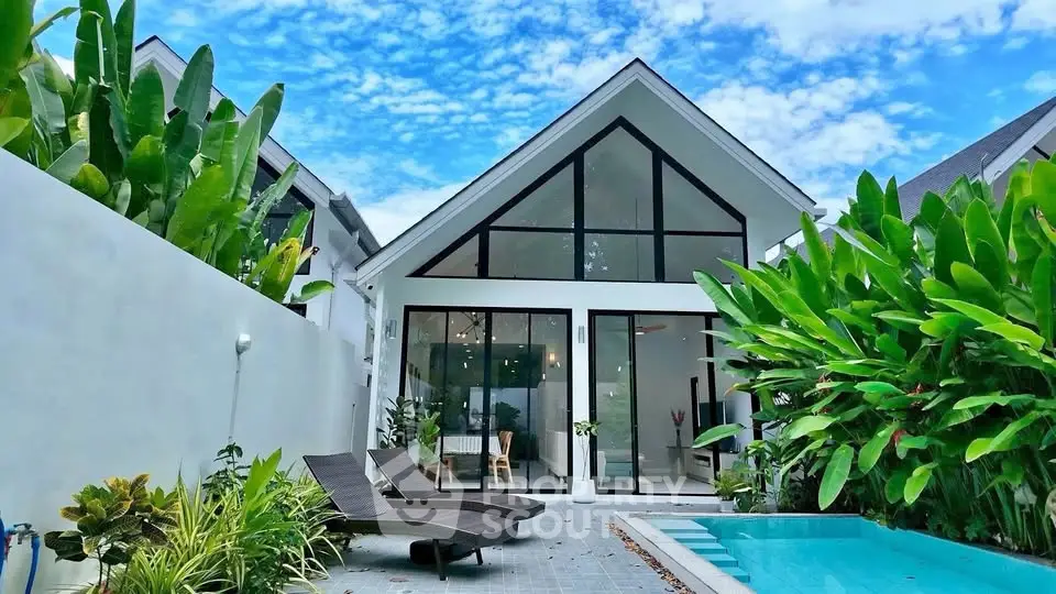 Stunning modern villa with pool and lush garden, featuring sleek architecture and expansive glass windows.