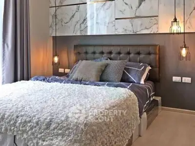 Luxurious bedroom with modern decor and plush bedding in a stylish apartment.