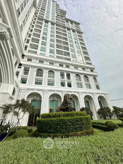 Stunning high-rise building with elegant architecture and lush landscaping