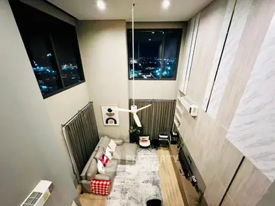 Stunning modern living room with high ceilings and city view