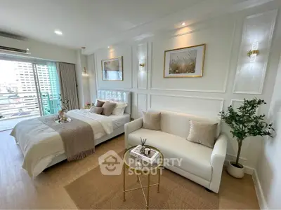 Luxurious bedroom with elegant decor and city view balcony, perfect for modern living.