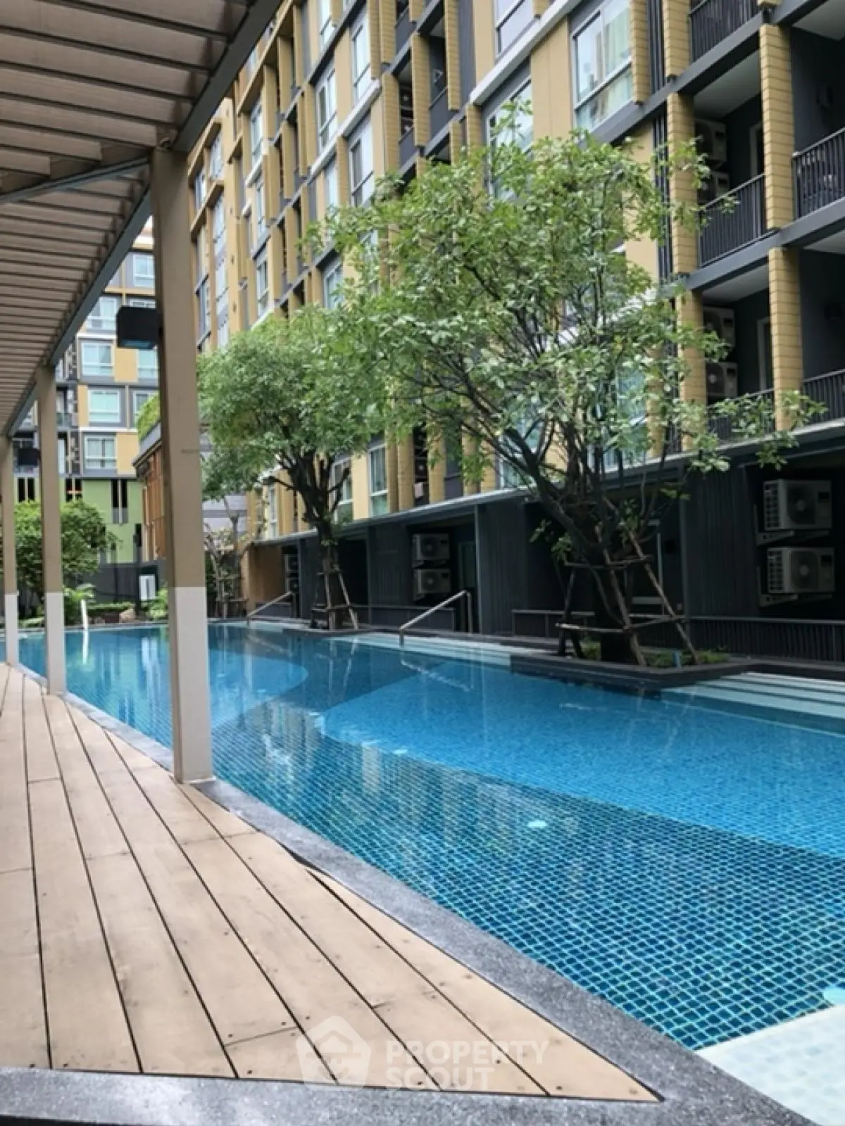 Luxurious condominium with stunning outdoor pool and modern architecture