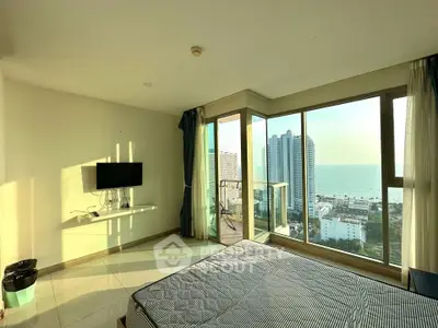 Stunning bedroom with ocean view and large windows in modern apartment