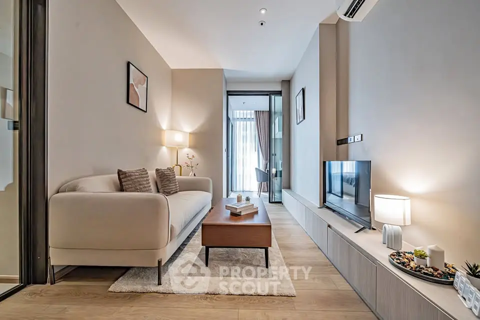 Modern living room with cozy sofa and stylish decor in a bright apartment.