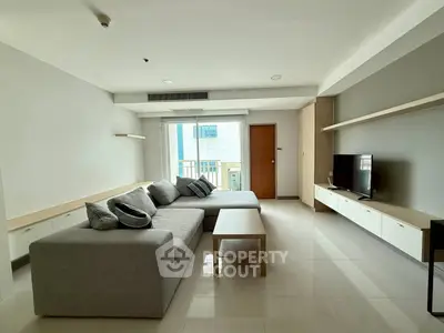 Spacious modern living room with sleek furniture and natural light